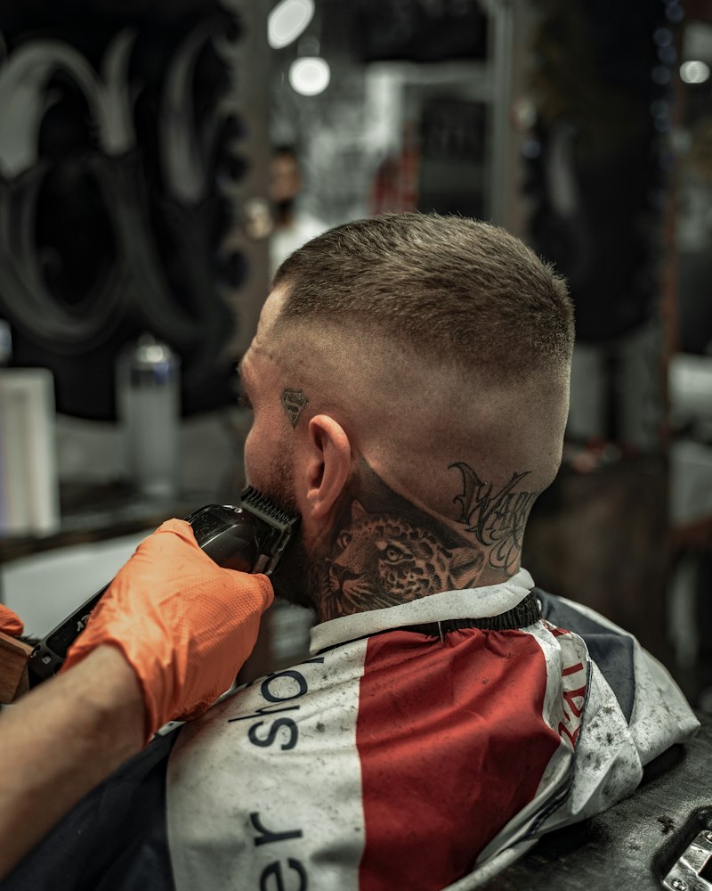 Close work with clippers along a guest’s neckline.